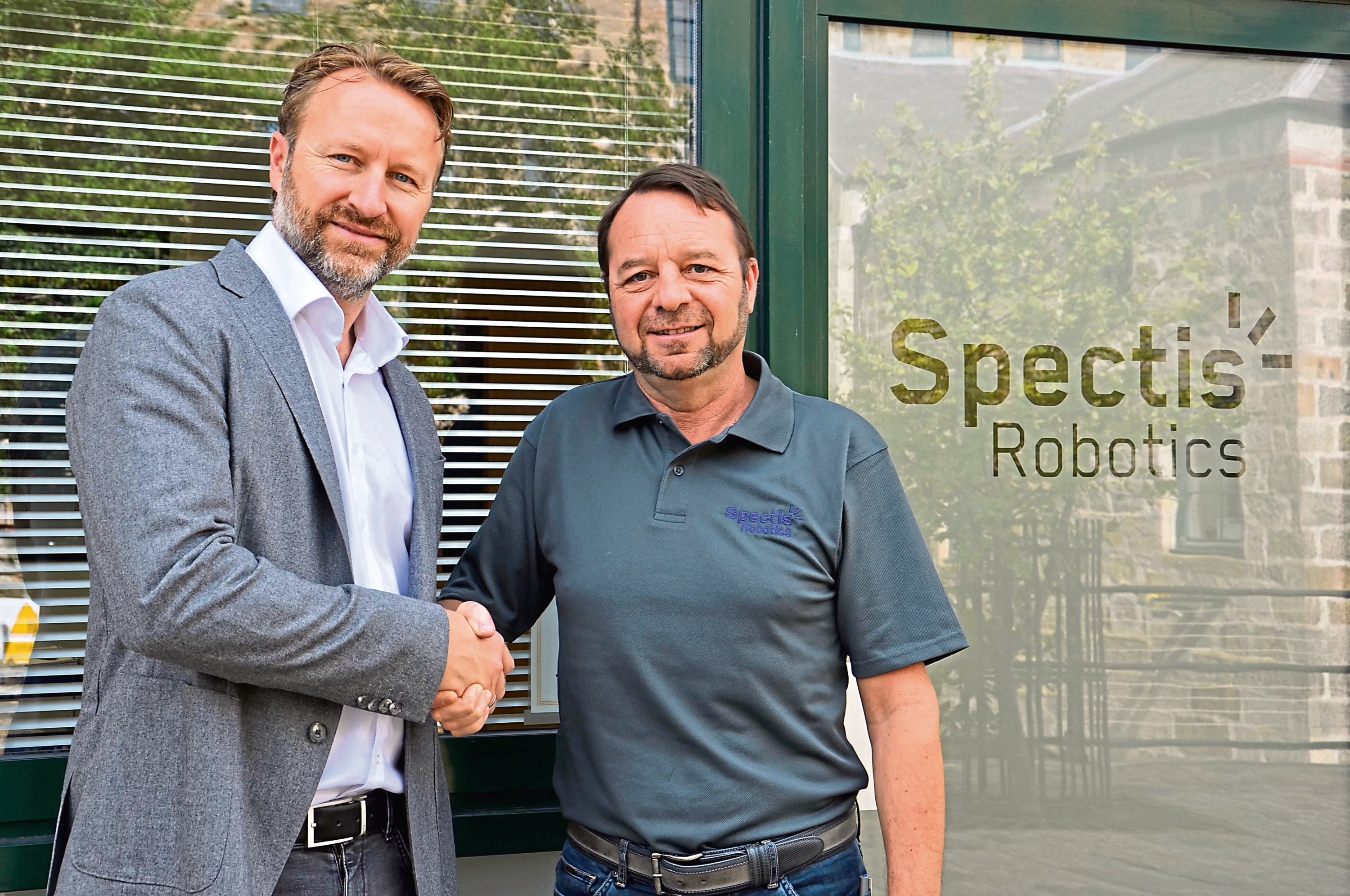 Marcus Jocham (left), head of business development at Dekra Visatec, and Brian Storie (right), managing director of Spectis Robotics.