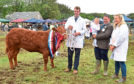Champion of champions I'll Be There with William Moir, beef interbreed judge David Clark with daughter Katie, and Rebecca Stuart.