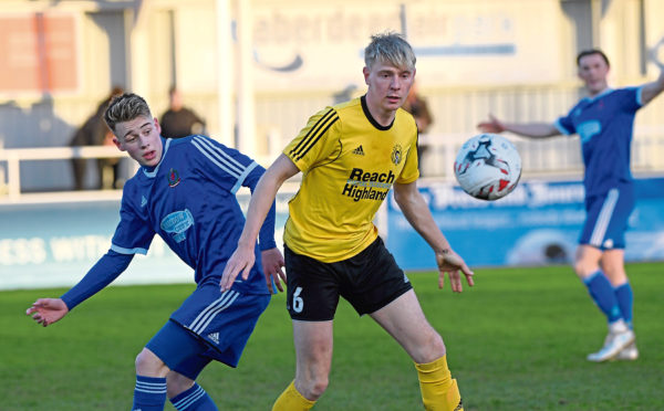 Press and Journal Highland League ; 
Cove Rangers (blue) v Nairn County (yellow) 
Pictured - Cove's Hamish MacLeod, Nairn's Adam Poritt.    
Picture by Kami Thomson    24-04-18