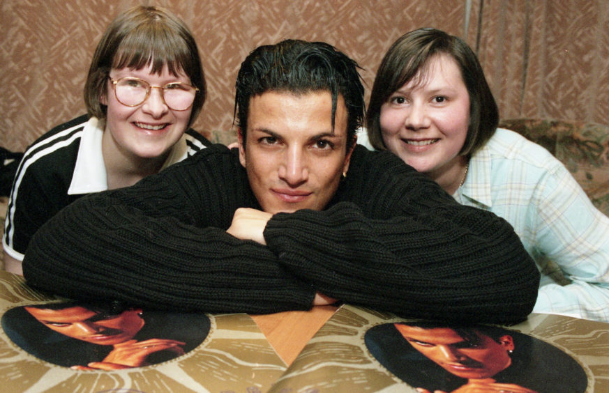 Evening Express competition winners Susan Michie and sister Fiona meeting Peter Andre before his concert at the AECC in July 1997.