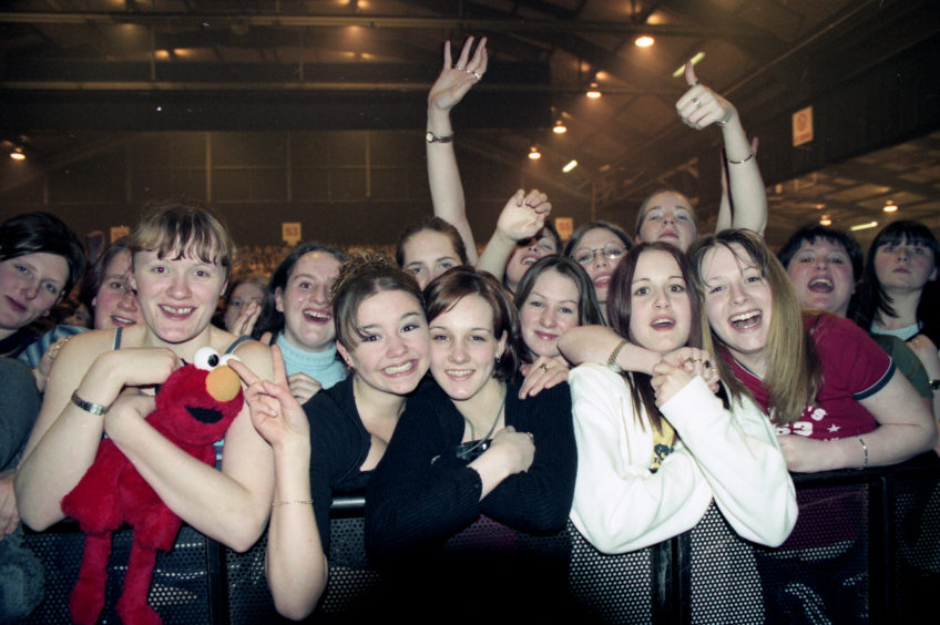 Fans watching Robbie Williams at the AECC in February 1999.