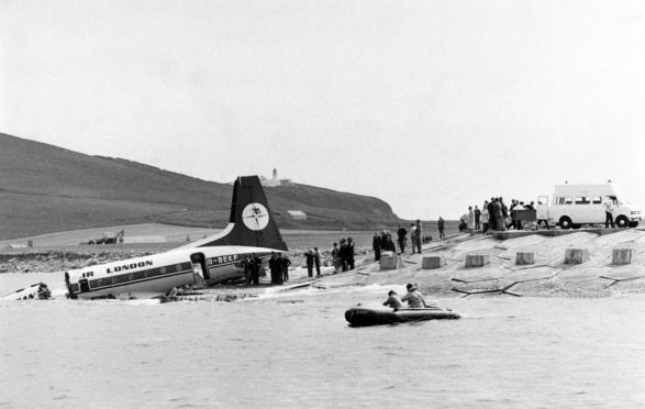 The rear section of the Dan-Air aircraft. The front section can be seen almost submerged at the left of the picture.