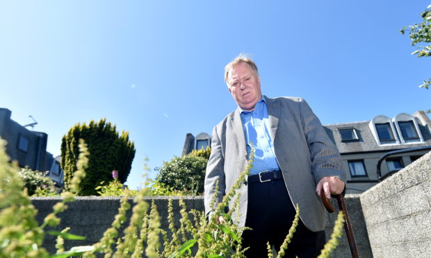 Cllr Bill Cormie claims that gardeners are only focusing on routes in Britain in Bloom competition. He will show the photographer the state of Short Loanings and nearby Leadside Road.

Pictured is Cllr Bill Cormie at Short Loanings.