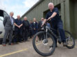 Duncan MacLachlan on his long service award of a bike.  Picture by Iain Ferguson/The Write Image