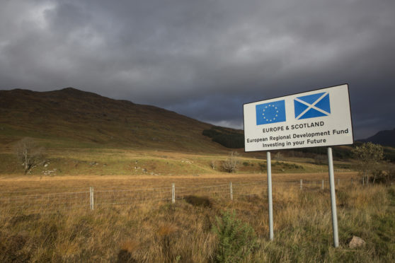 A road sign in Wester Ross promoting the European Regional Development Fund on the 4th November 2018 on the west coast of Scotland in the United Kingdom. The development fund is a partnership with the European Union and Scotland to invest in the Scottish future. (photo by Sam Mellish / In Pictures via Getty Images Images)