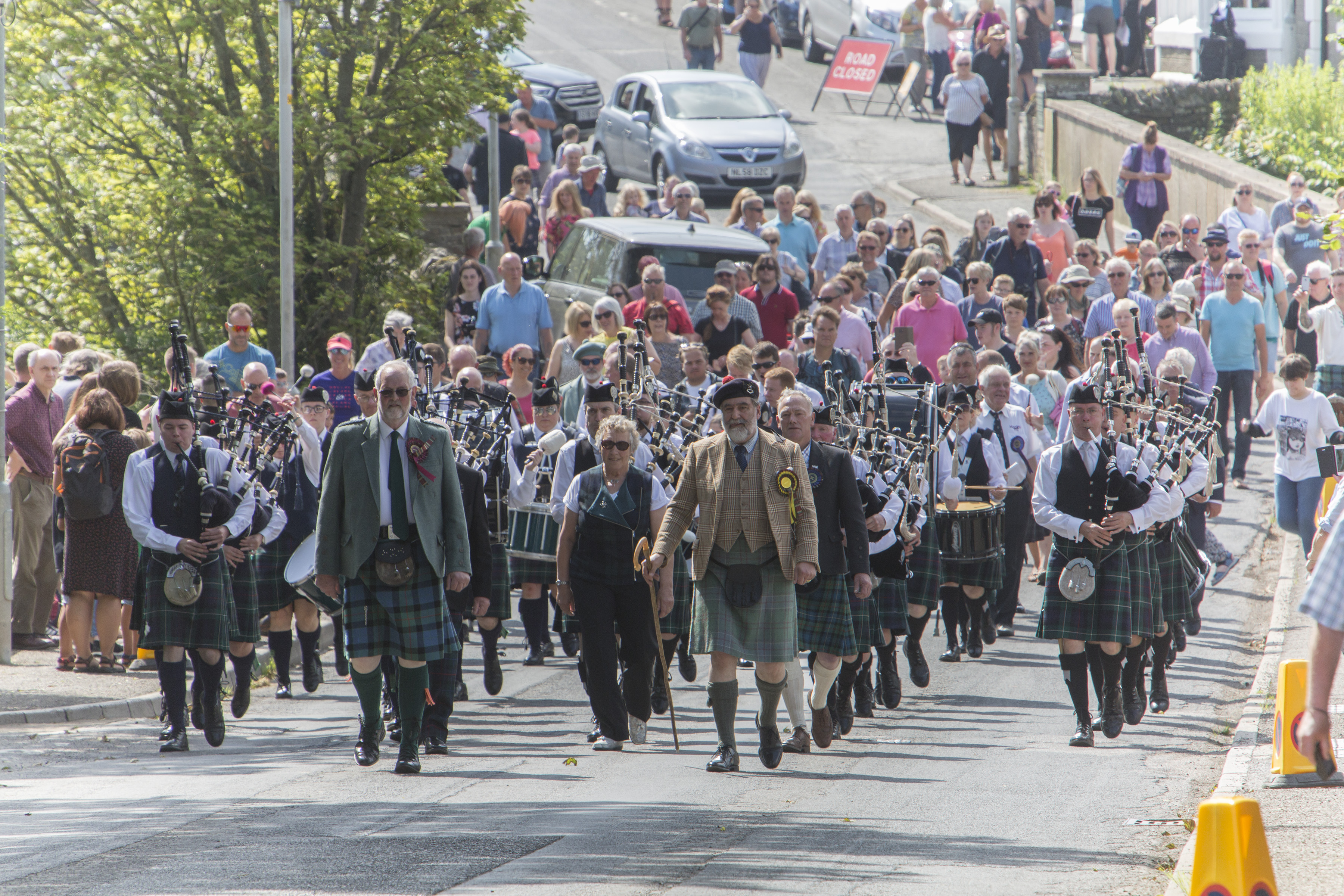 Halkirk Highland Games chieftain, Lord Thurso, (front right) and president Alistair Swanson, (front left), lead the massed pipebands from Thurso and Wick, along with officials and members of the public from the centre of the village to the games field.