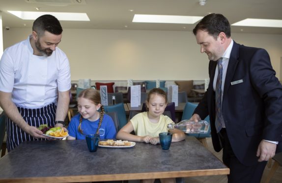 Head chef Stuart Matheson and general manager Robert Day serving some treats to Amelie Rae Annie-Jane Simpson