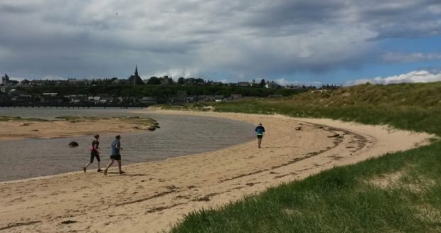 Runners on Lossiemouth beach