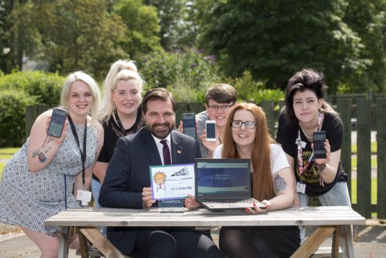 31/07/19
Tiffy Burnett, Mega Rhynd, Councillor John Wheeler, jason Urquhart, ,Megan pirie, (Children's rights Champion), Renee Bertram; 

Aberdeen City Council has formally adopted a new app to help care-experienced young people make their voices heard.At an event today (Wednesday 31 July) at Westburn Resource Centre, staff and young people were among the audience giving their feedback on the Mind of My Own app which has been on trial since March.The app enables young users to make their voices heard and make decisions on their lives by saying how they are feeling, what support they need and to tell their care worker about the things that are important to them.