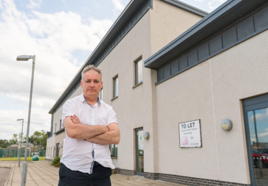 MSP for Moray, Richard Lochhead outside the Moray Coast medical Practice in Lossiemouth.