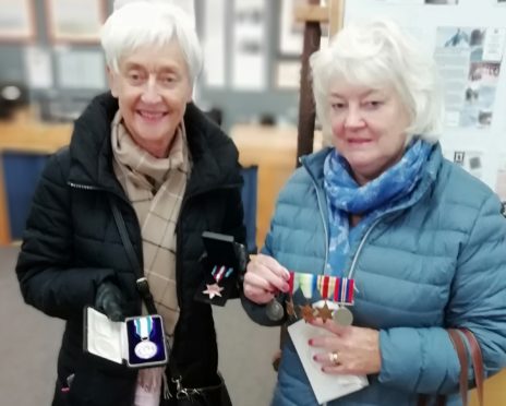 Mr Thomson's daughters Helen Forbes and Sandra Hutton have delivered the medals to the exhibition centre in Aultbea