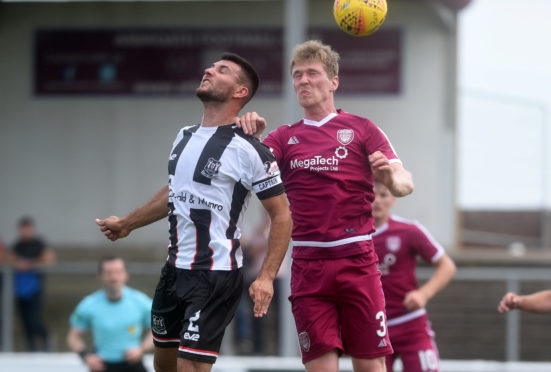 Betfred Cup
Arbroath v Elgin City
Gayfield Park, Arbroath
Pictured are Elgin captain Matthew Cooper and Arbroath's Colin Hamilton
Picture by DARRELL BENNS    
Pictured on 21/07/2018