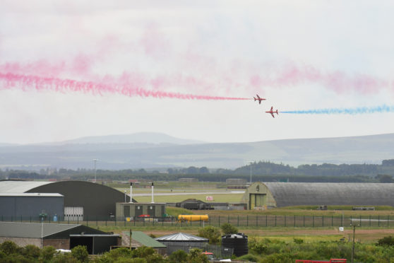 Red arrows perform over RAF Lossiemouth today.

Pictures by JASON HEDGES