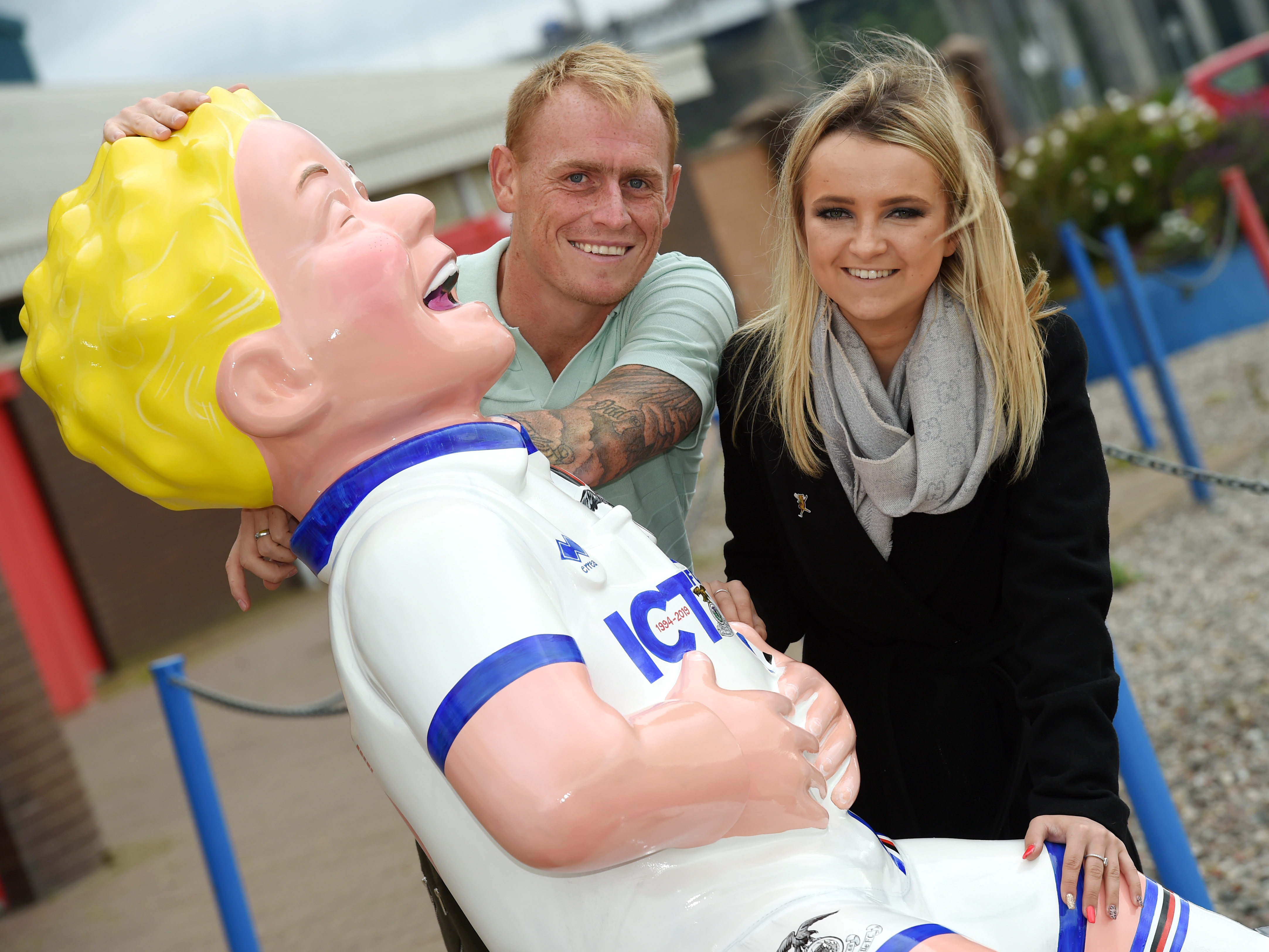 Club Captain Carl Tremarco with Dawn Cowie, Highland Fundraising Officer with Archie photographed with Oor Willie.