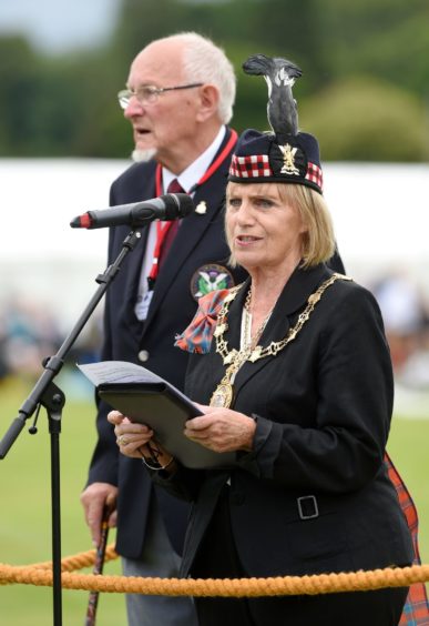 Provost and Chieftain of the games, Councillor Helen Carmichael officially opens the event. Also in the photograph is Angus Dick, Chairman of the organising committee. Picture by Sandy McCook