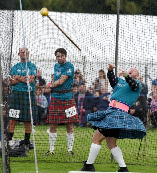 Luke Cowley from America competing in the Mens Scots' Hammer competition. Picture by Sandy McCook