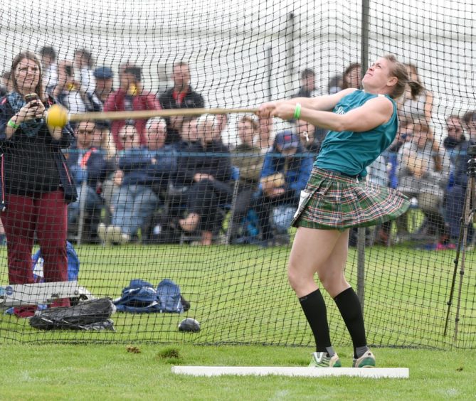 Katie Crawley competing in the Scots hammer. Picture by Sandy McCook