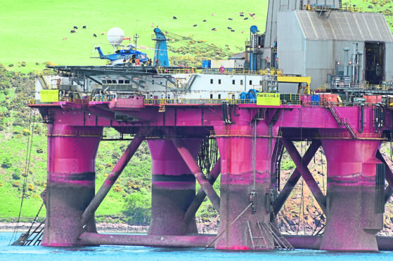 A Helicopter lands on the BP-operated rig, to deal with Greenpeace activists who boarded it.
Picture by Sandy McCook