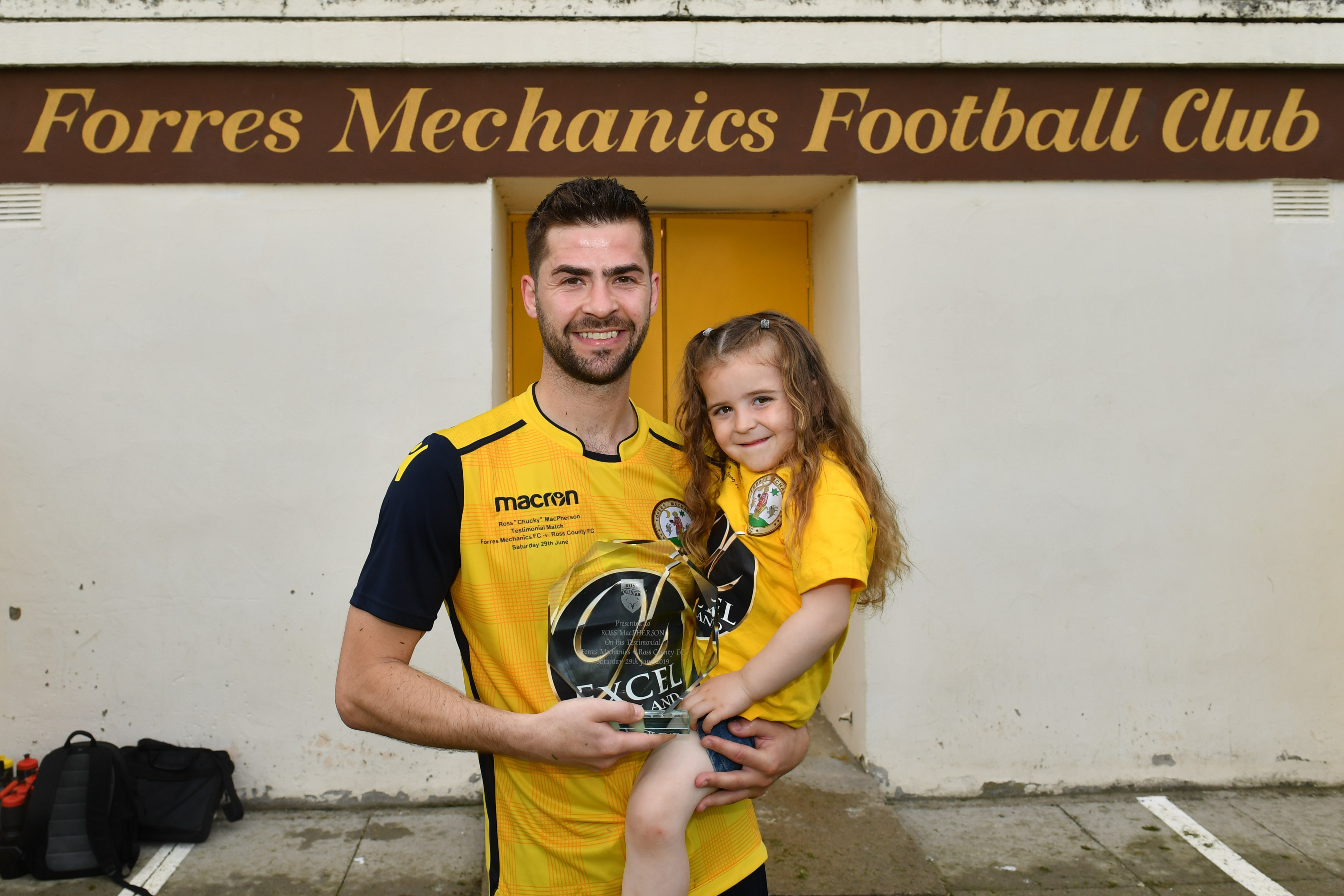 Ross MacPherson with his testimonial match trophy and daughter Jesse.


Picture by Jason Hedges