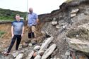 Councillors Ross Cassie (L) and Mark Findlater at the scene of the coastal erosion near Banff bridge.