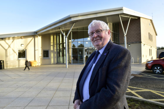 Man standing outside building.