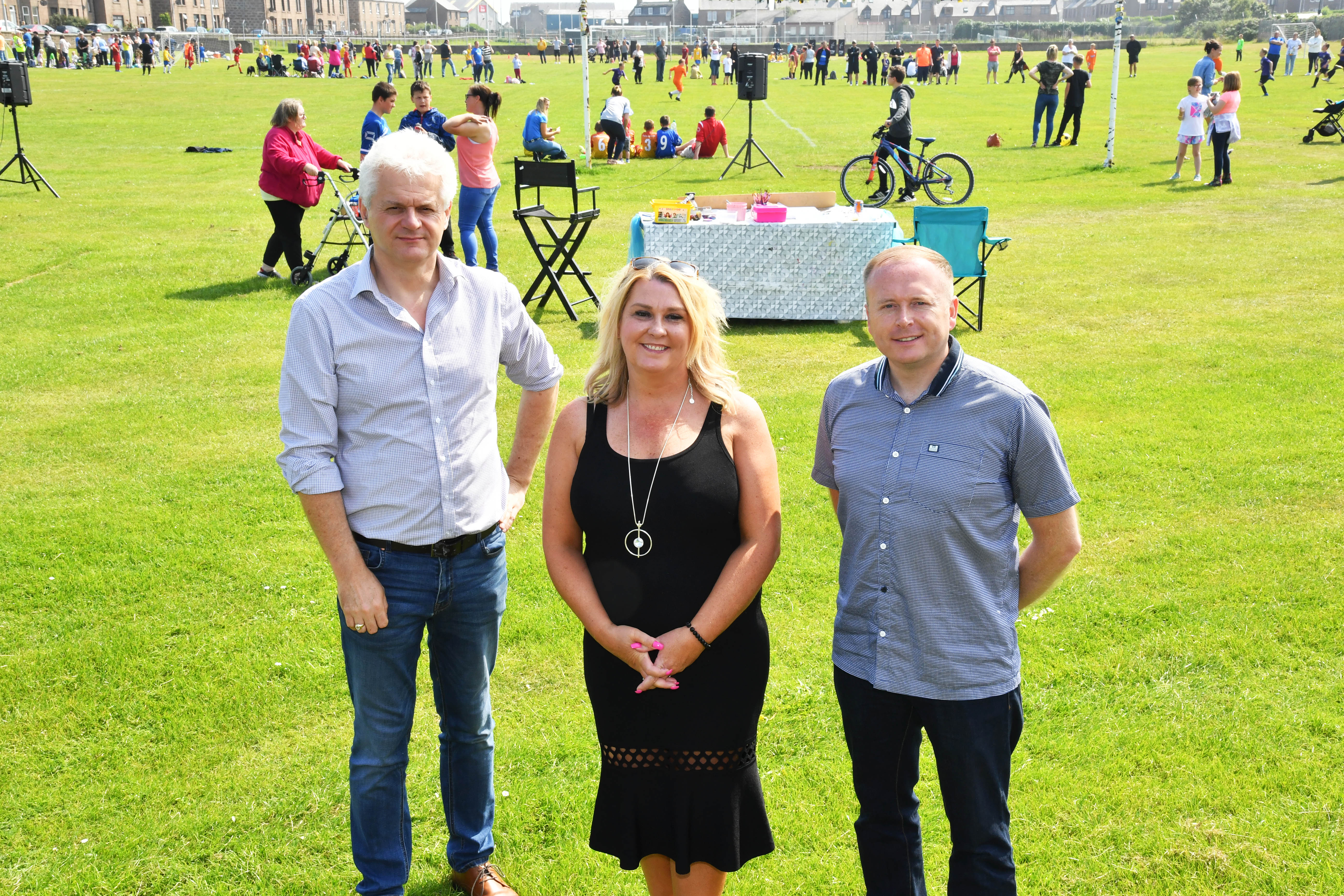 PACT COMMITTEE MEMBERS (L TO R) ALAN FAKELY,SECY,DIANNE BEAGRIE,CHAIR AND GRAHAM MACKIE,VICE CHAIR AT THE FOOTBALL EVENT.