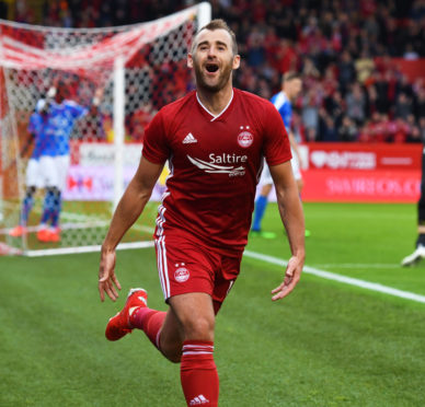 Niall McGinn wheels away in delight after making it 1-0 to Aberdeen.