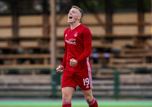 Lewis Ferguson wheels away in delight after making it 2-1 to Aberdeen.