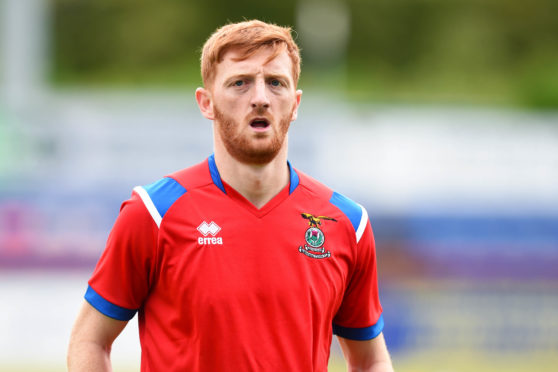 David Carson warms up ahead of kick-off.