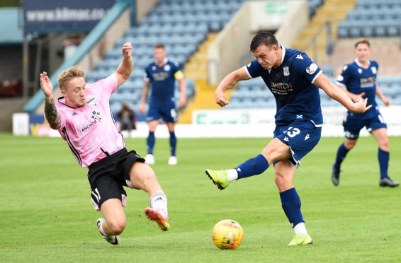 Peterhead's Aidan Smith blocks a shot from Dundee's Jordan Marshall.