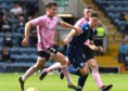 Josh Mulligan, right, in action for Dundee against Peterhead in last season's League Cup.