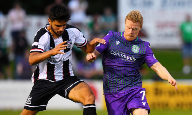 Rabin Omar, left, in action for Elgin against Daryll Horgan of Hibs.