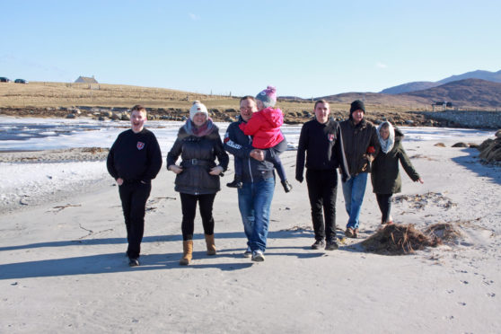 Happy family: Bryn, Sarah, Angus, Isla and Seth at the beach with Sarah’s parents, Keith and Kath Bramley