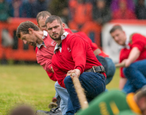 Elgin compete in the tug of war contest.