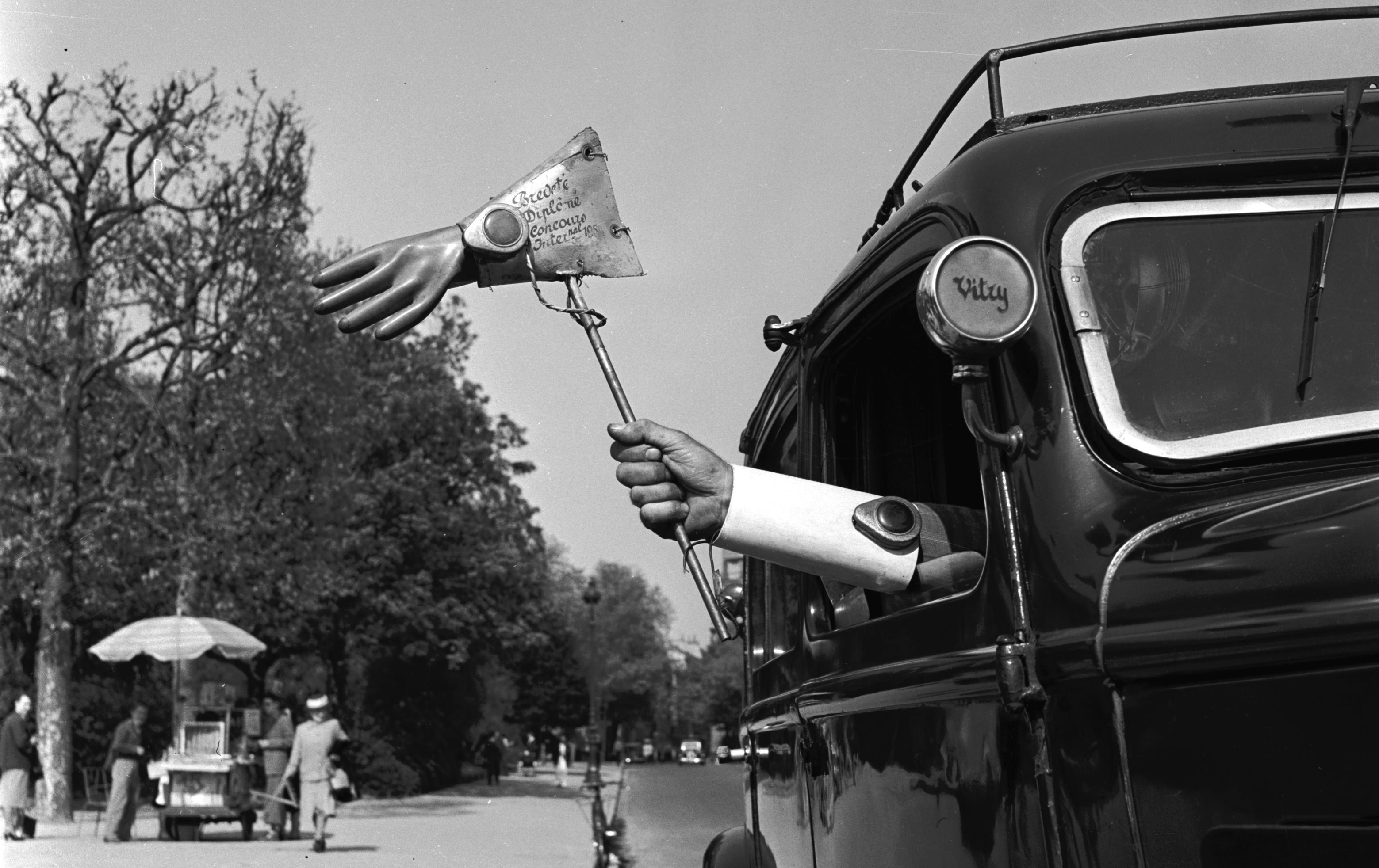 1955:  French taxi driver Pierre Alidiere has won accolades for his range of inventions, including this 'trafficator' glove which lights up to indicate that his cab is turning.  (Photo by Vagn Hansen/BIPs/Getty Images)