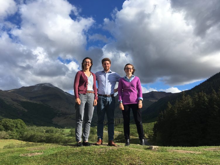 Pictured with part of the Tranter’s Round ridgeline in the background are three of the ambitious team (from left) Penny Coles, Calum Hogg ad Heledd Rheinallt.