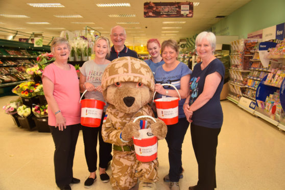 Volunteers with the bear