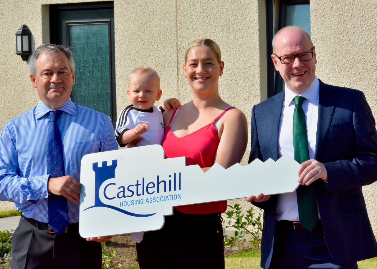 David Lappin, chief executive at Castlehill, tenant Alanna Begg and her son Blak and  housing minister Kevin Stewart