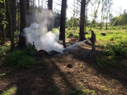 Firefighters doused the hot fire remnants with 2200 litres to make it safe