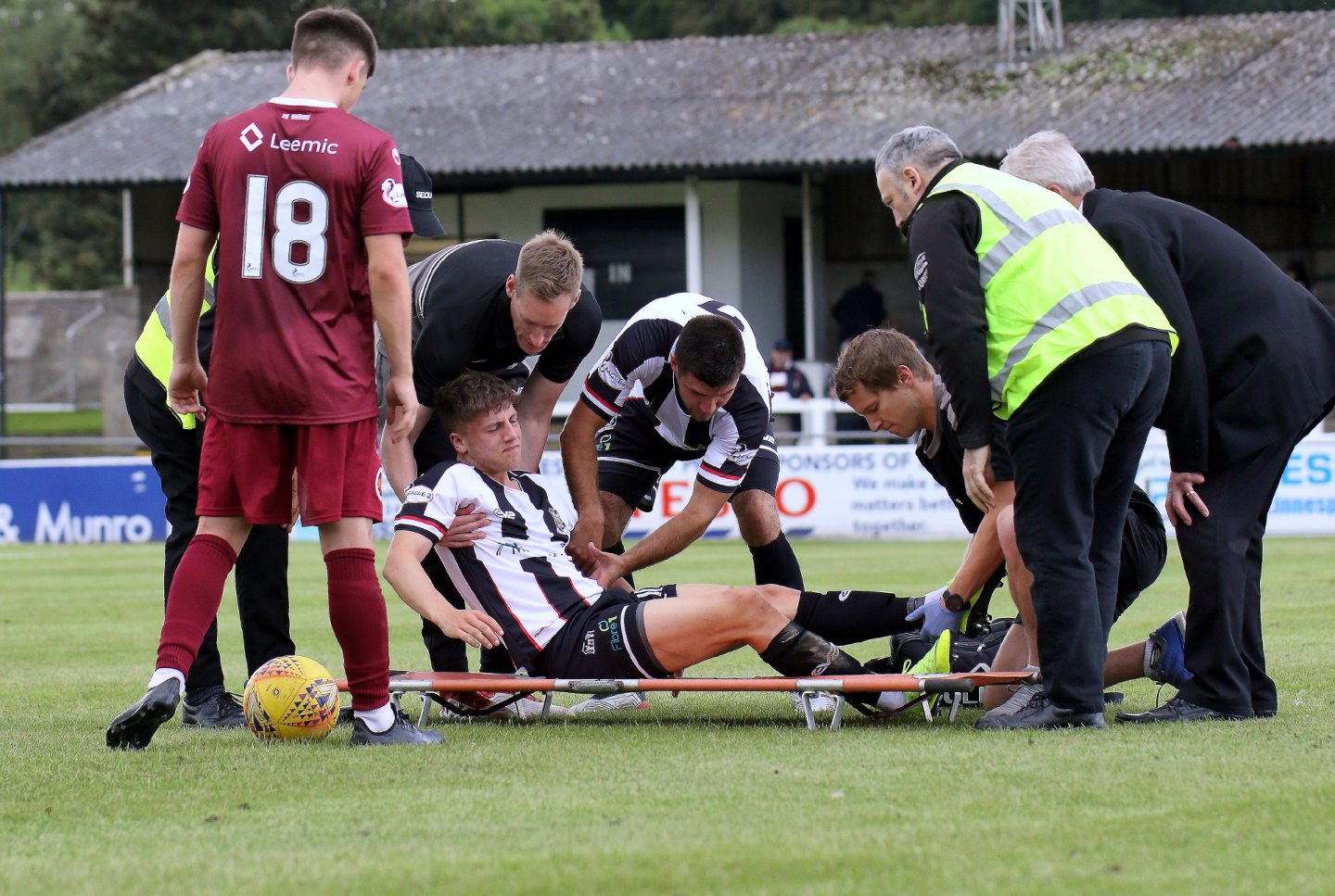 Daniel MacKay gets stretchered off with a damaged left ankle injury.