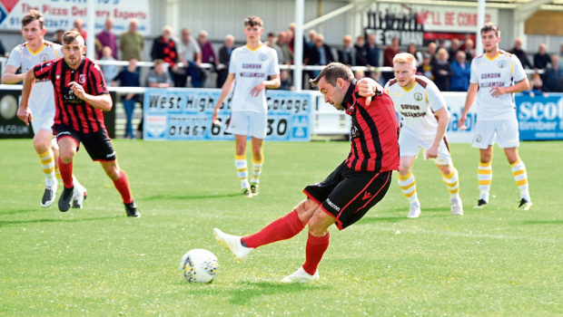 Neil Gauld taking a penalty. 
Picture by Jim Irvine