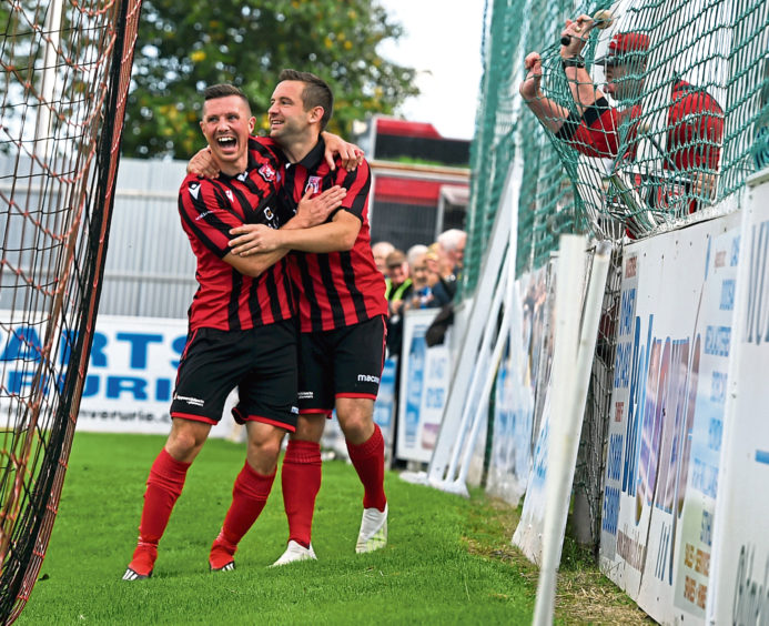 Ryan Stott, left and Neil Gauld celebrate Neil's second goal. 
Picture by Jim Irvine