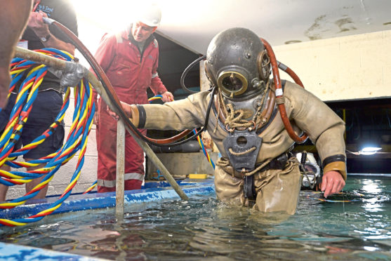 Diver -
VINTAGE DIVER 31/8/18 Paul (Ginge) Guiver emerges from the tank at Fort Williams Underwater Centre. PICTURE IAIN FERGUSON, THE WRITE IMAGE