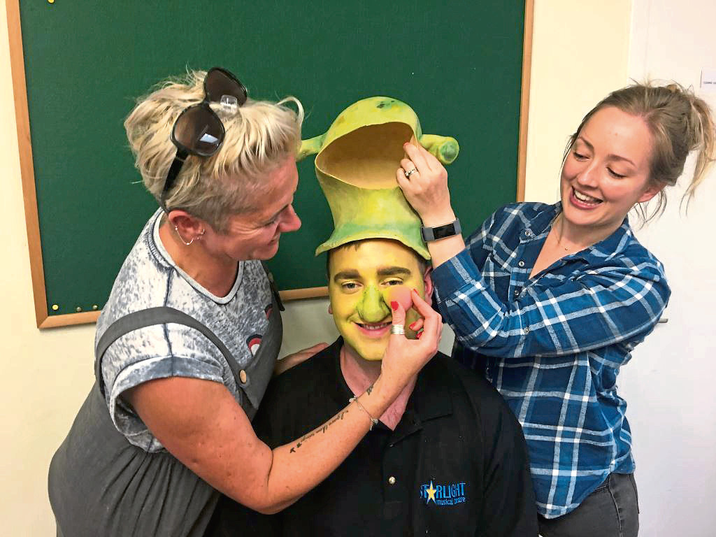Make-up artists Sam Whitby and Madeleine Hewitt get to work on Liam MacAskill who stars as Shrek