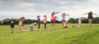 Children from the Newtonhill Out of School Club recreate the TechFest sign at The Bettridge Centre.