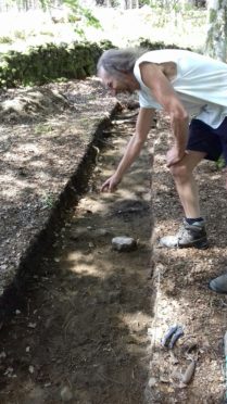 Colin Shepherd at the site of the archaeological excavation at Bennachie.