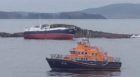 Fifteen crew members were dramatically rescued from the vessel after it ran aground in the Vee Skerries off Shetland, with Aith lifeboat standing by for large parts