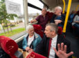 Highlands and Islands MSP David Stewart talks to passengers on the bus.