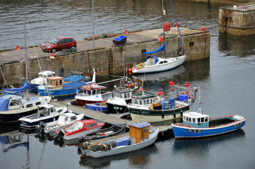 Boats docked at the Portknockie Harbour