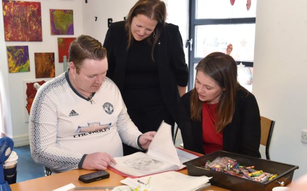 The Cabinet Secretary for Communities Aileen Campbell  (right) visited Aberdeen Foyer. She is speaking to service user Shaun Watt in the art class. Also pictured is Foyer Chief Executive Leona McDermid.
Picture by COLIN RENNIE    August 20, 2019